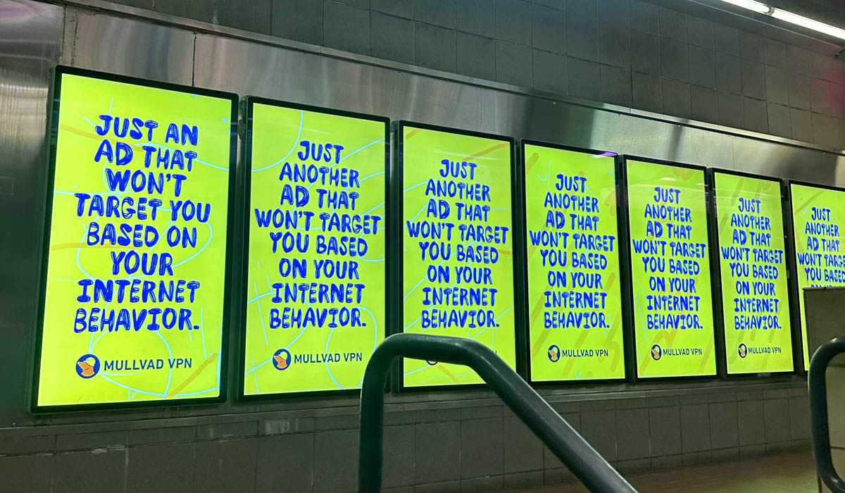 Row of green Mullvad VPN ads in a transit station: JUST ANOTHER AD THAT WON'T TARGET YOU BASED ON YOUR INTERNET BEHAVIOR. MULLVAD VPN.